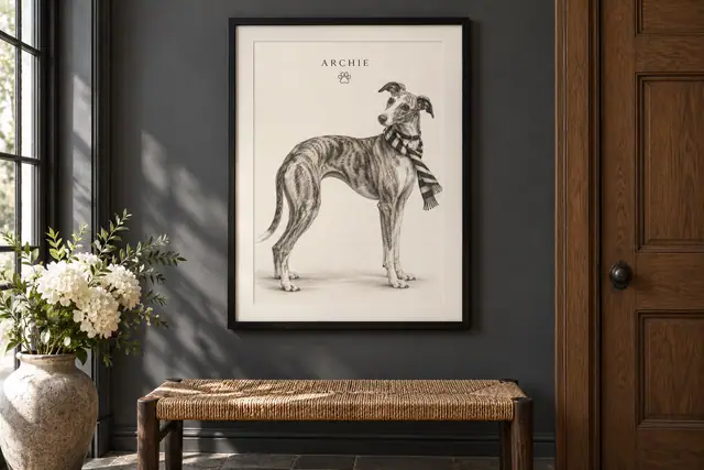 Black-framed whippet drawing on a grey hallway wall beside a dark oak doorway and woven bench